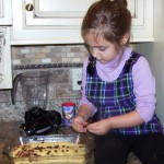 Breaking nuts for the cookie bars