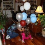 My wonderful sister-in-law attaching balloons to Abby