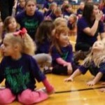 The instructor is talking and the little girls really listening well. Can you tell?