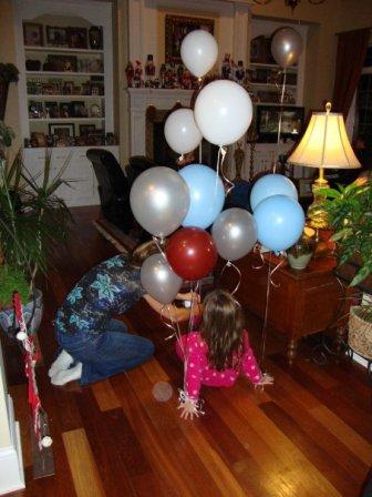 My wonderful sister-in-law attaching balloons to Abby