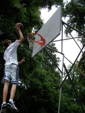 Grant soating high for a slam dunk-I never tire of watching our twins play ball!