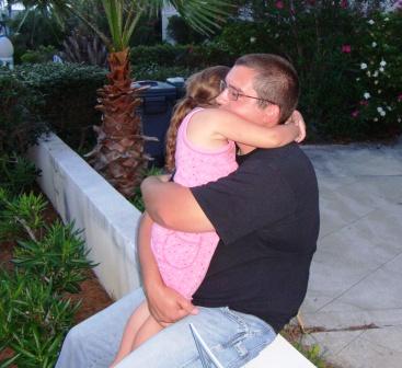 My oldest son hugging and granddaughter hugging each other
