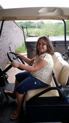 Abby in golf cart