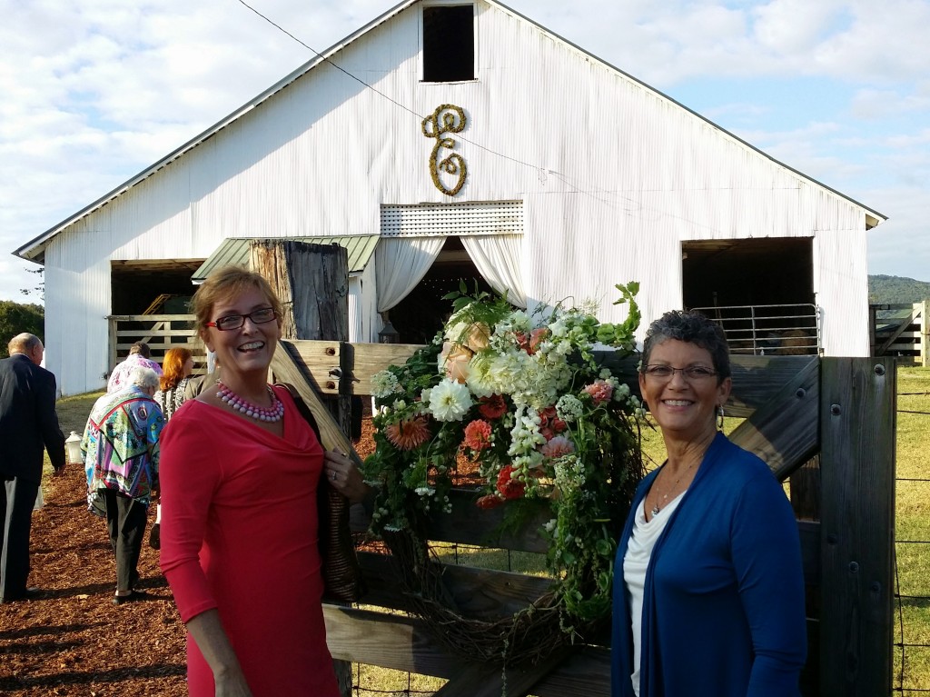 This is me and my cousin Martha in front of the barn I was telling you about. The big letter E stands for the couples last name and was placed there just for the reception.
