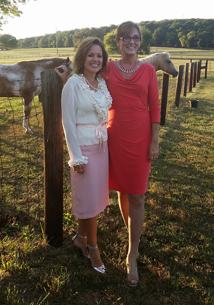 My sister-in-law Kelly and myself....don't know the names of the horses in the background!