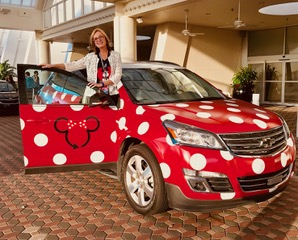Teresa with red with white polka dots minnie mouse car