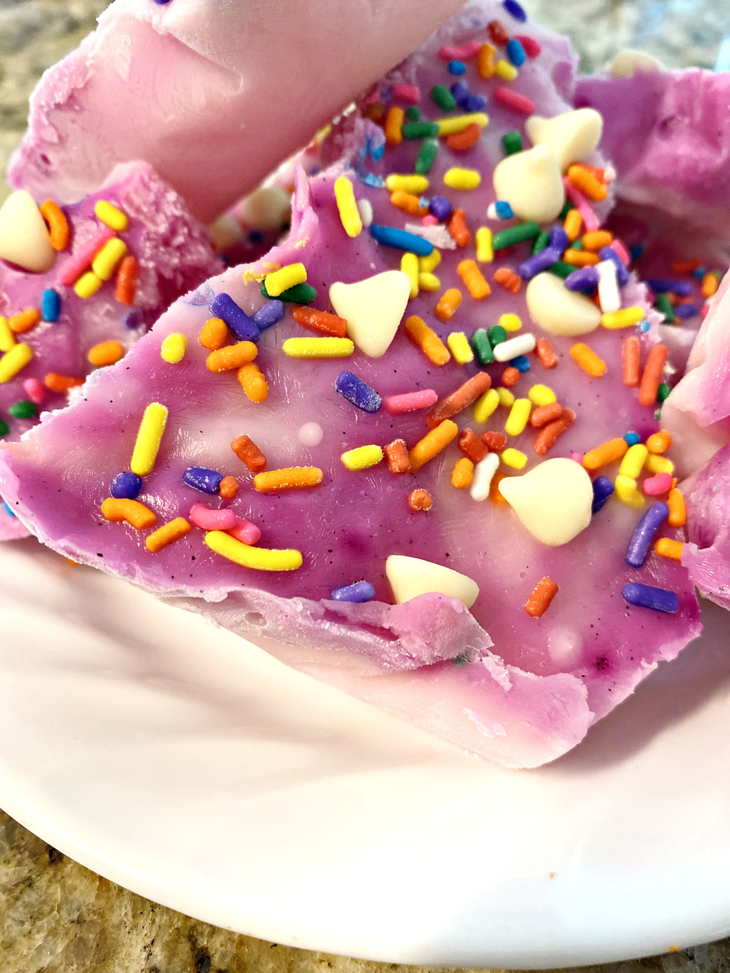 purple frozen yogurt bark and rainbow sprinkles