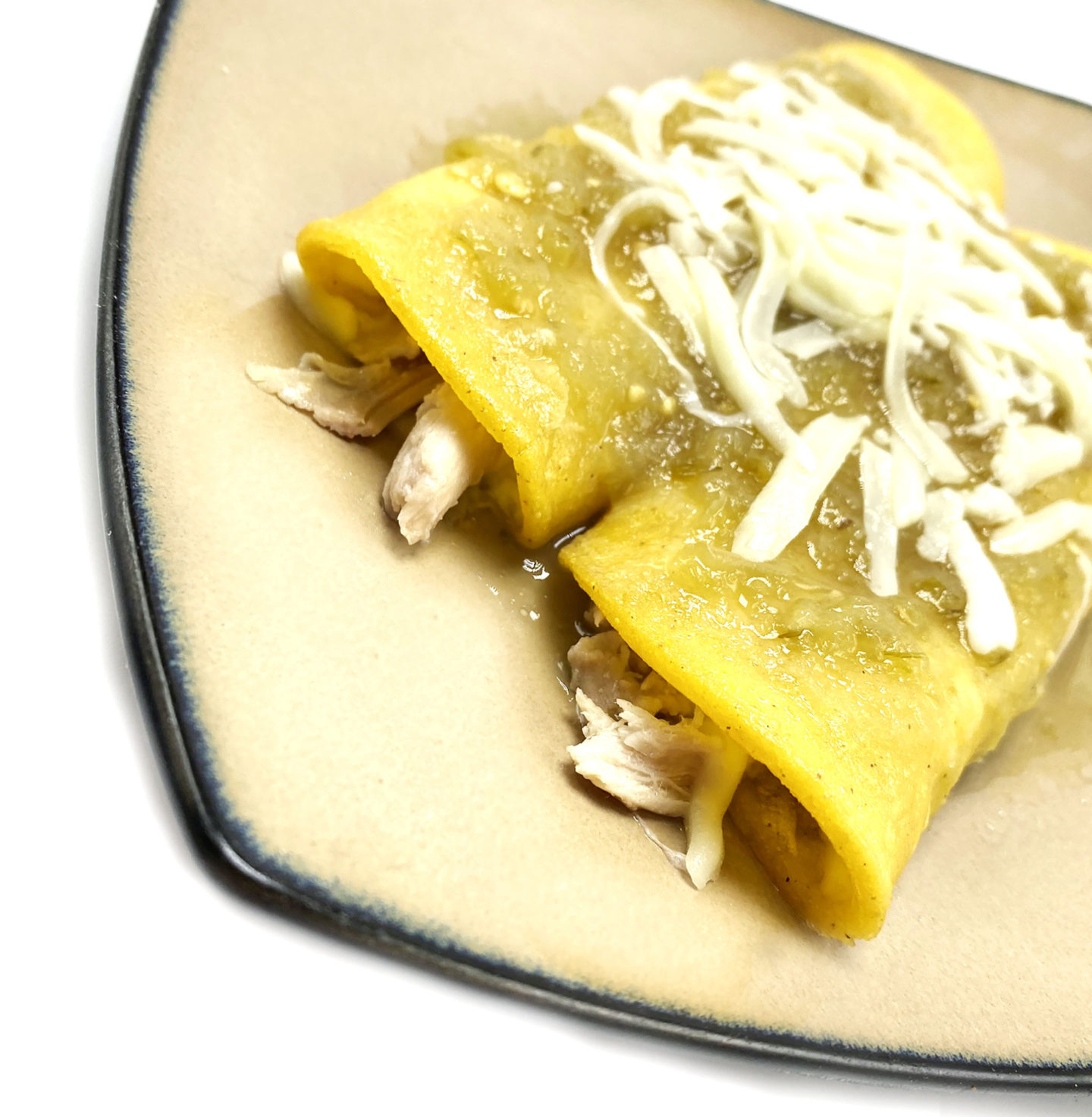 chicken enchiladas with green sauce and cheese  closeup