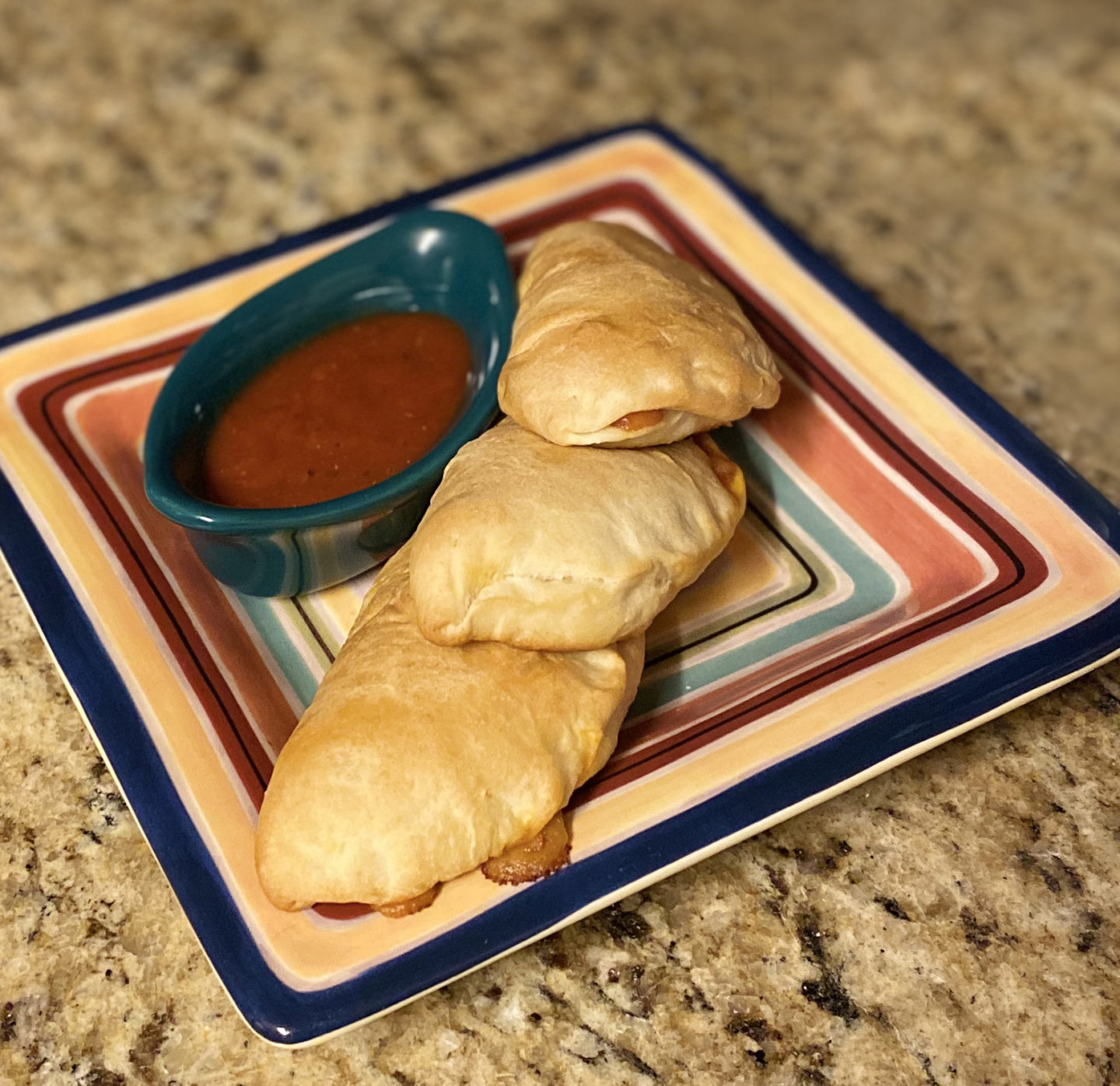 mini calzones on a plate square