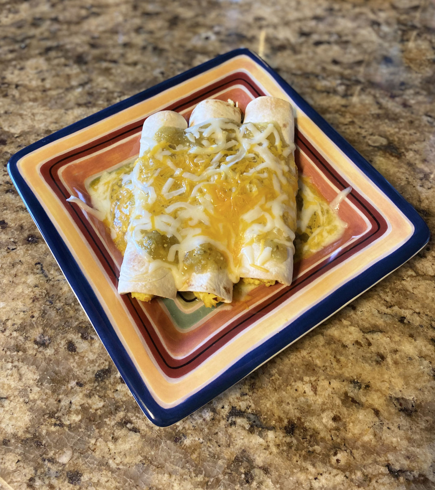 smothered breakfast taquitos top view