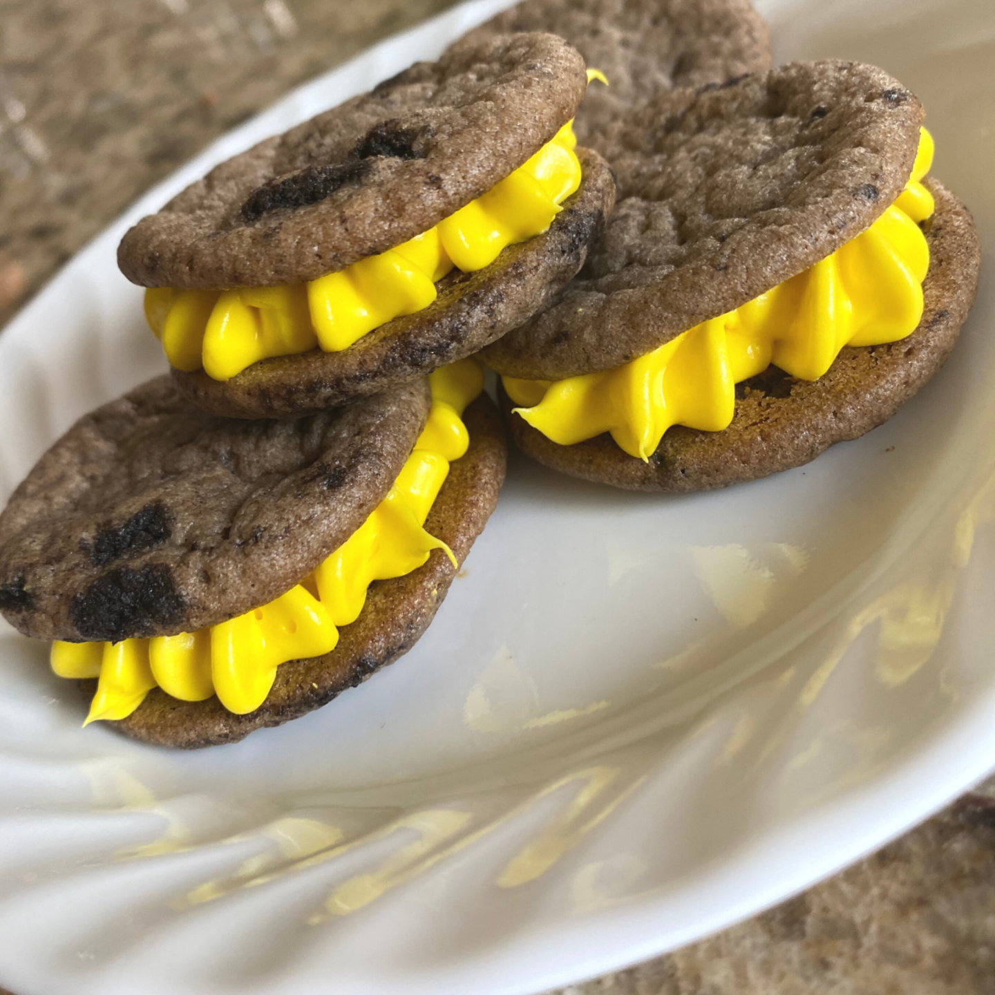 Oreo sugar cookie sandwiches with swirl yellow frosting