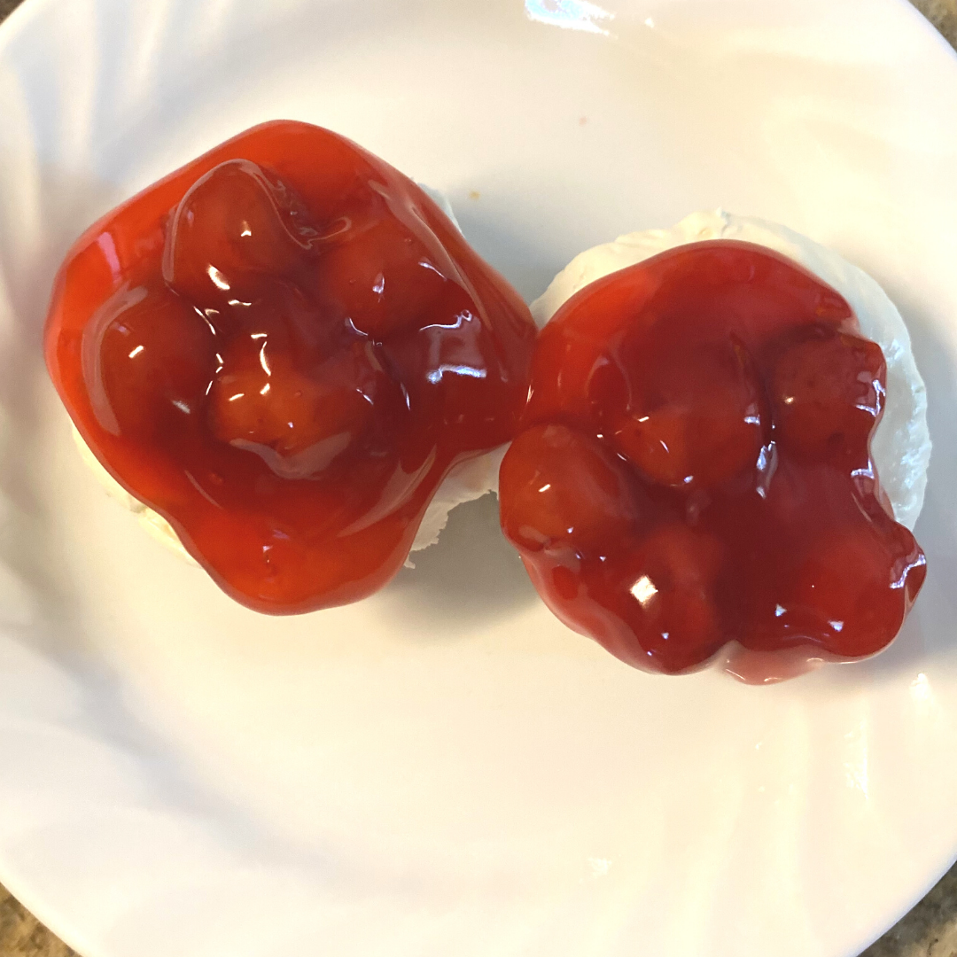 top view of 2 Mini cherry cheesecakes on a plate