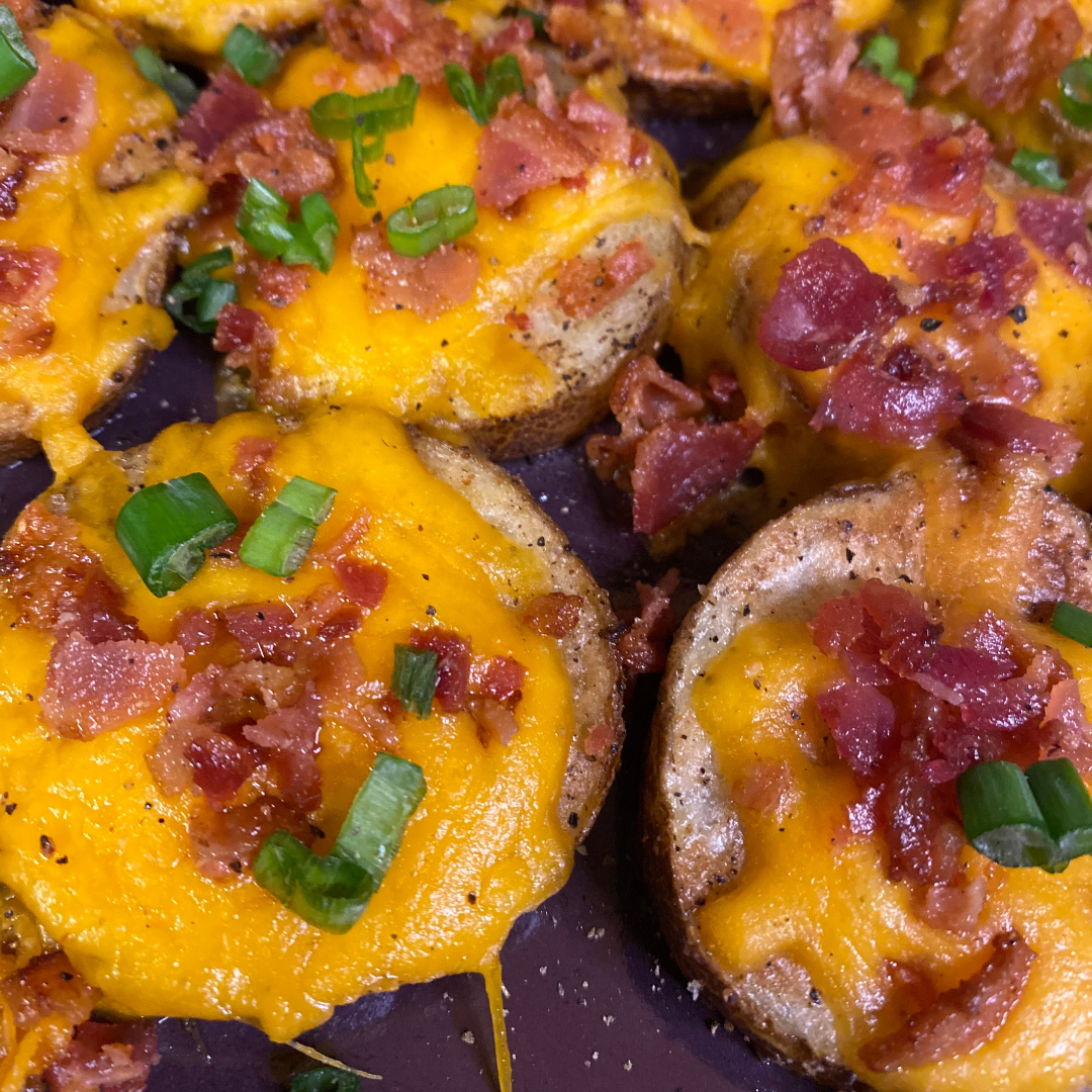baked potato slices with bacon cheese and green onions