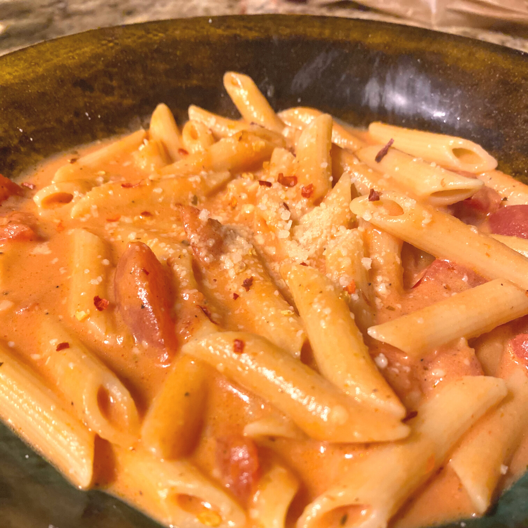 close up of zesty tomato penne pasta