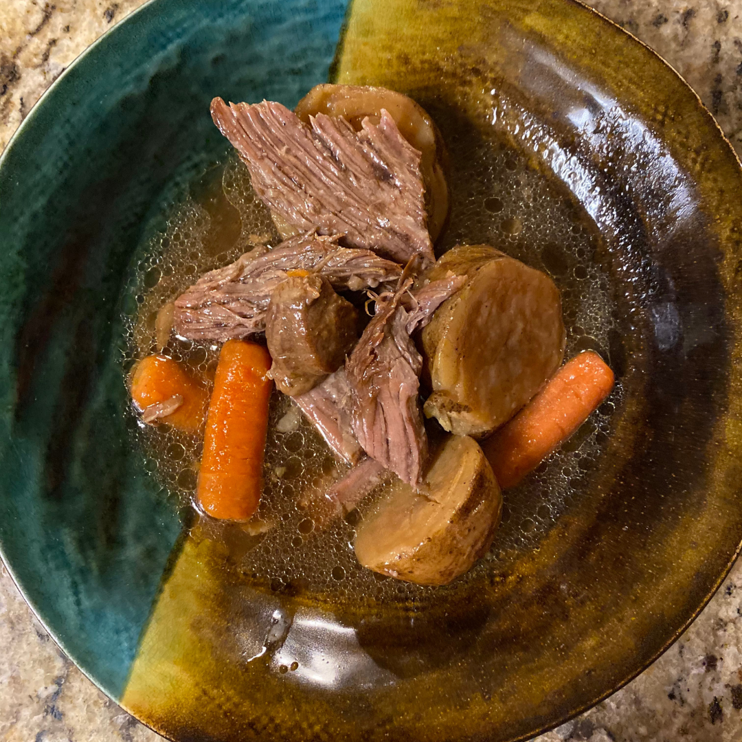 top view of pot roast potatoes and carrots