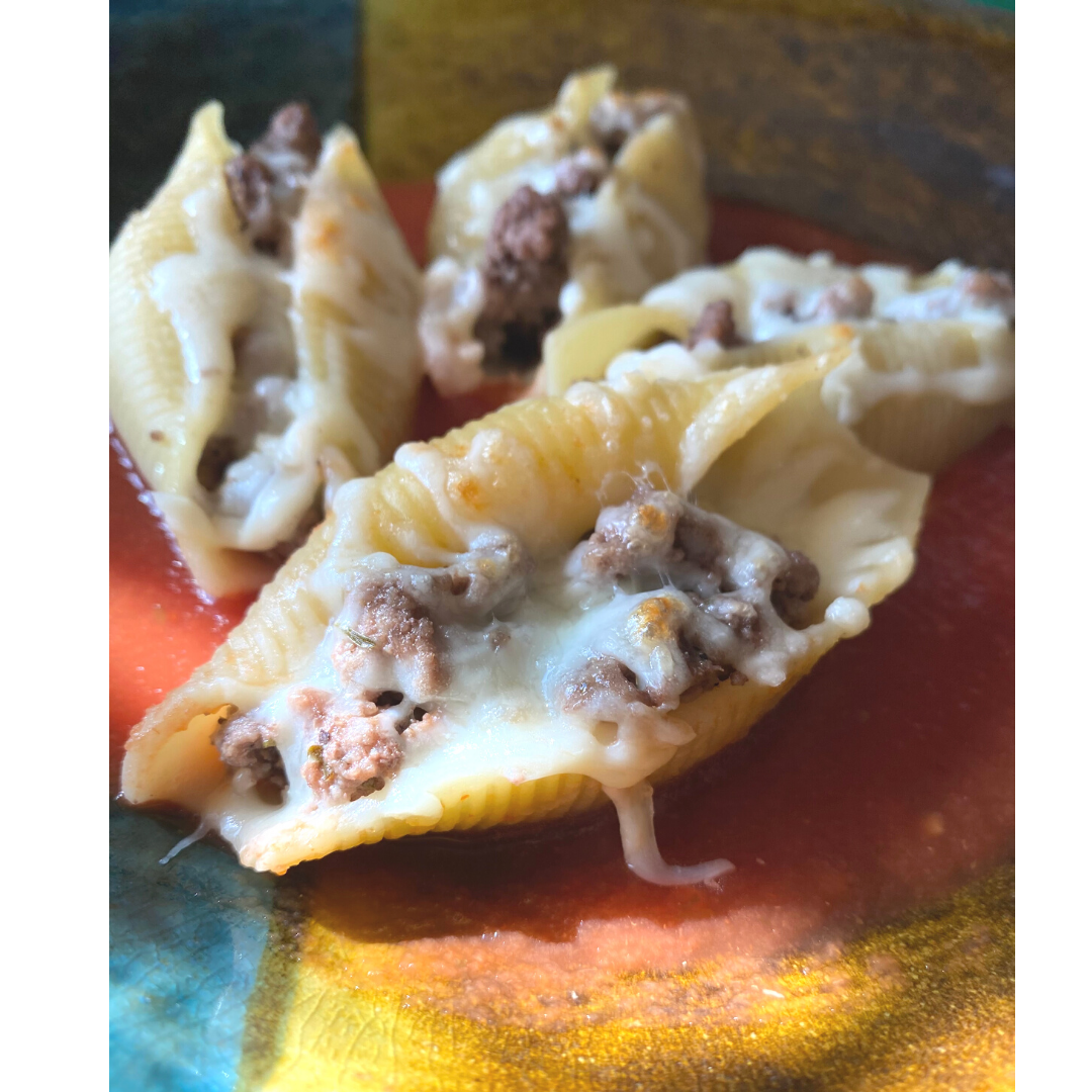 close up of stuffed beef and cheese pasta shells