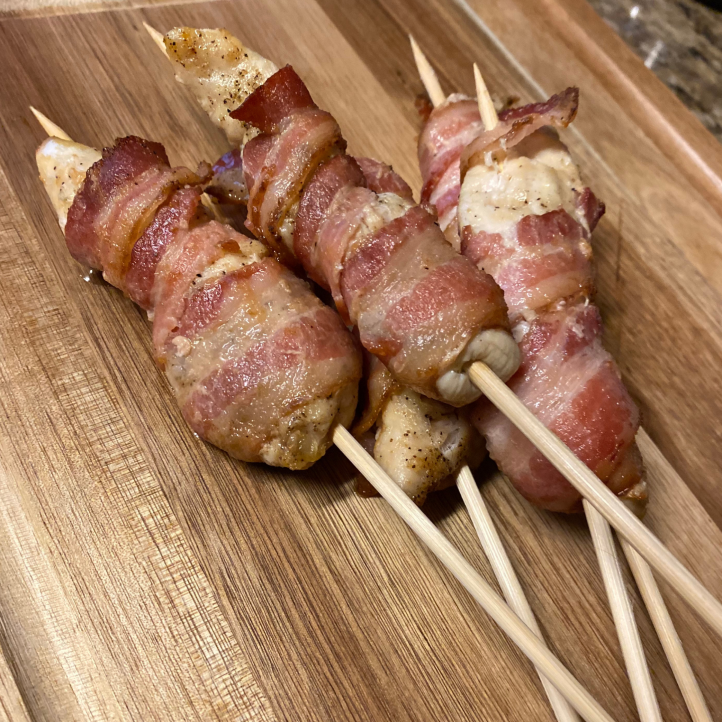 bacon wrapped chicken on skewers