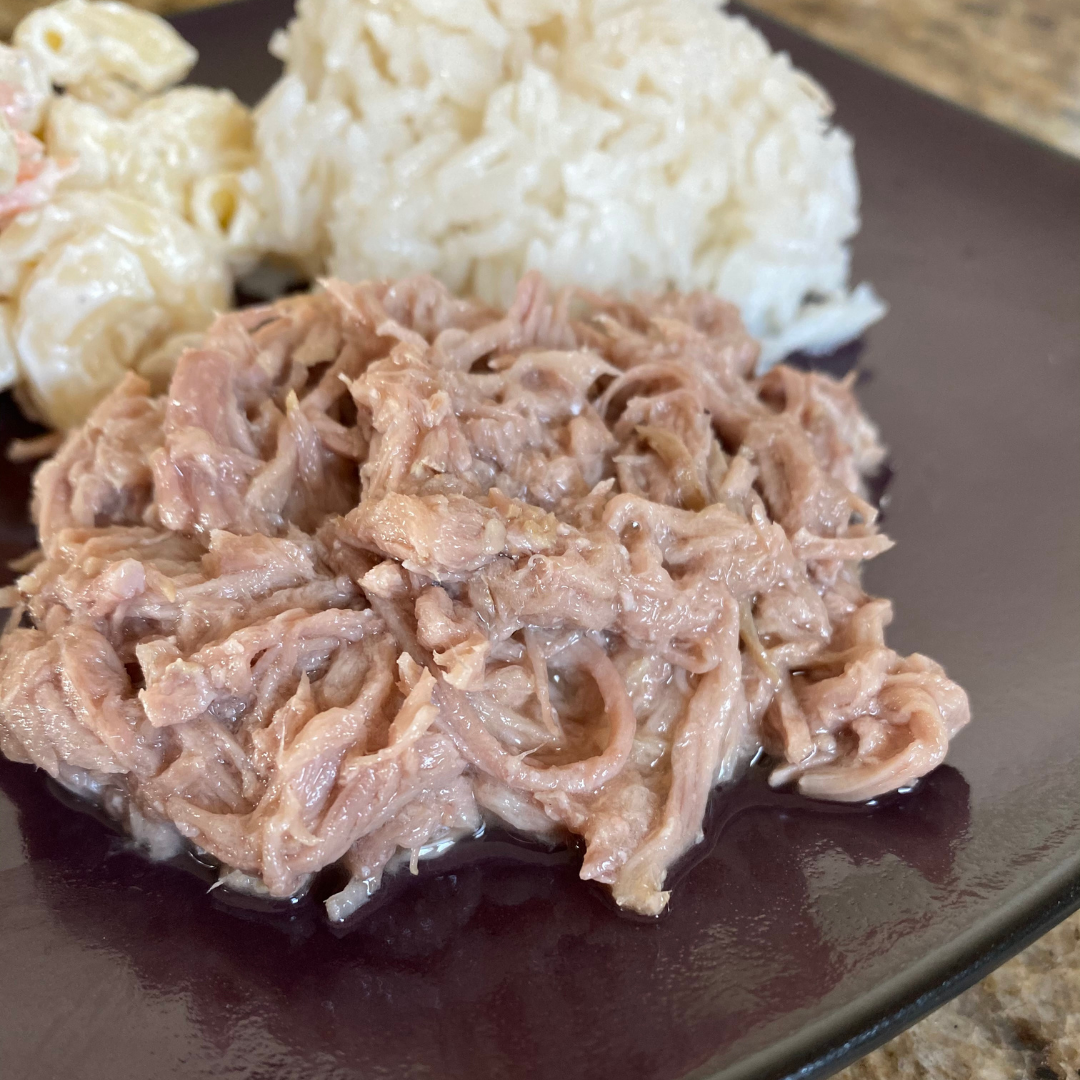 close up of kahlua pork rice and hawaiian macaroni salad on plate