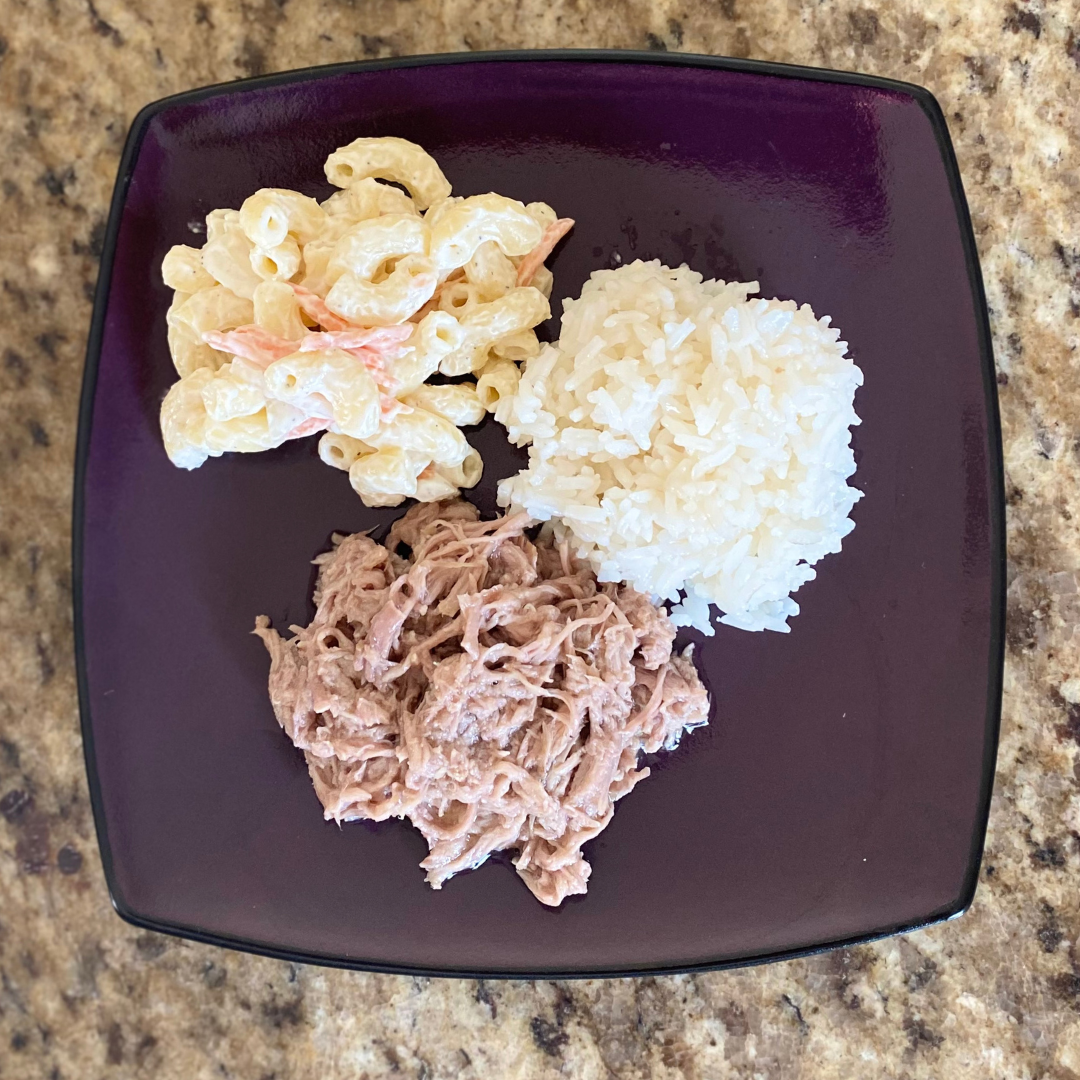 kahlua pork rice and hawaiian macaroni salad on plate from top view