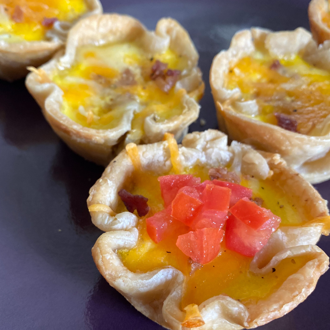 mini omelette cups with bacon and tomatoes close up