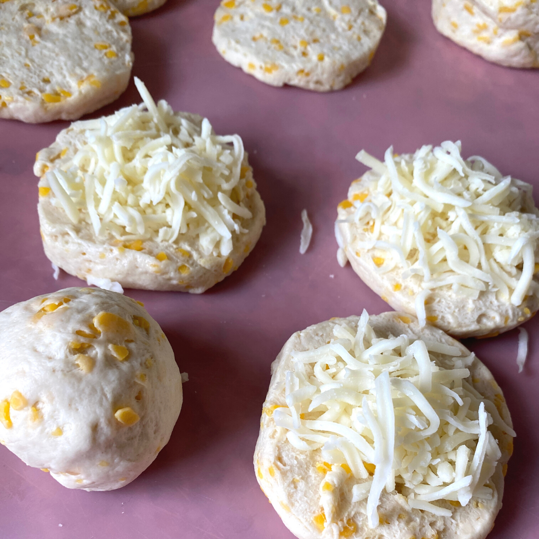 biscuit dough covered with shredded mozzeralla cheese