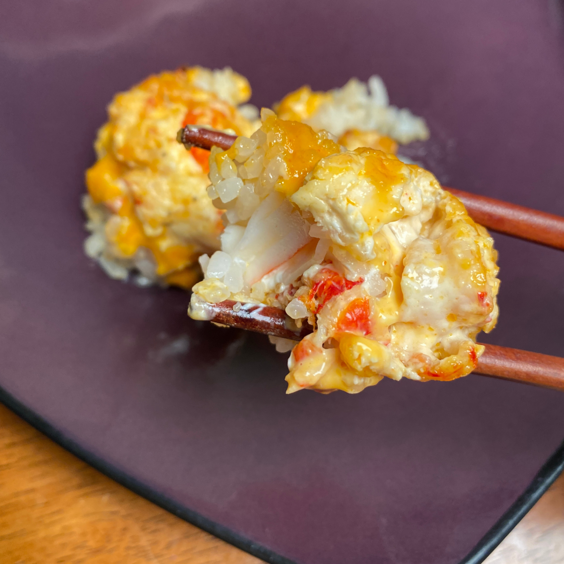 crawfish sushi on chopsticks