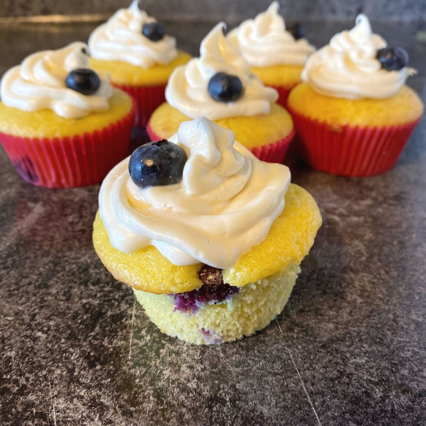 group of blueberry lemon frosted cupcakes.jpg