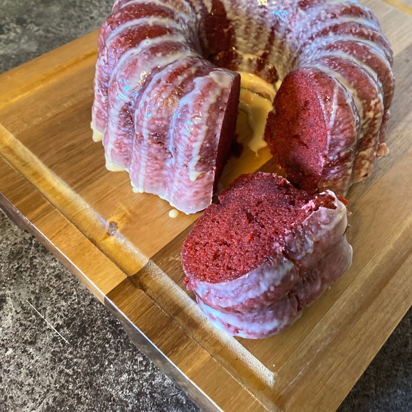 red velvet bundt cake with one slice cut