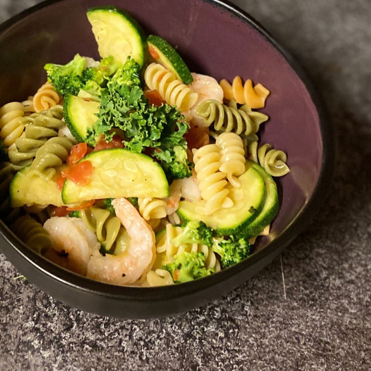 bowl of shrimp and sauted vegetables with pasta