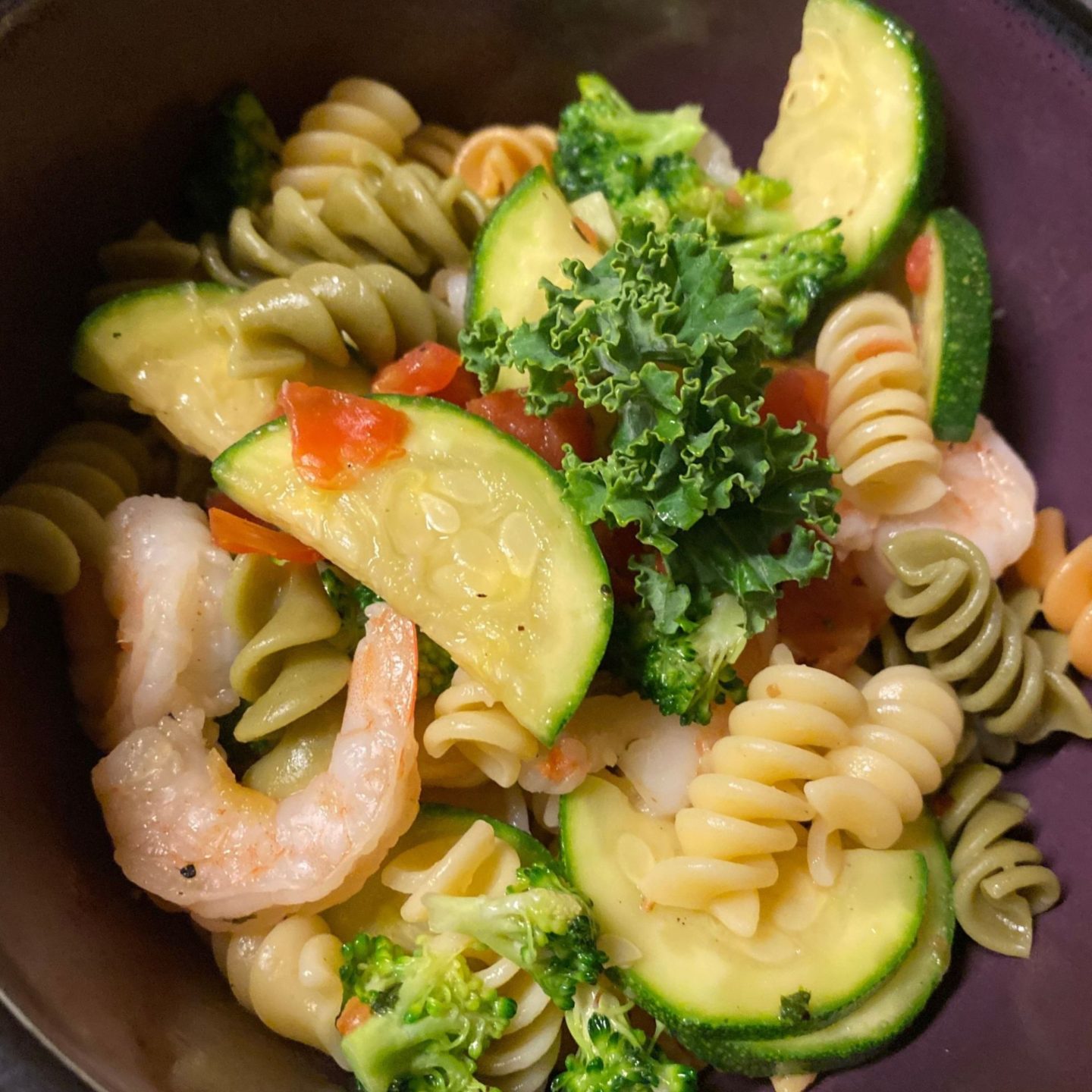 closeup of bowl of shrimp and saluted vegetables with pasta