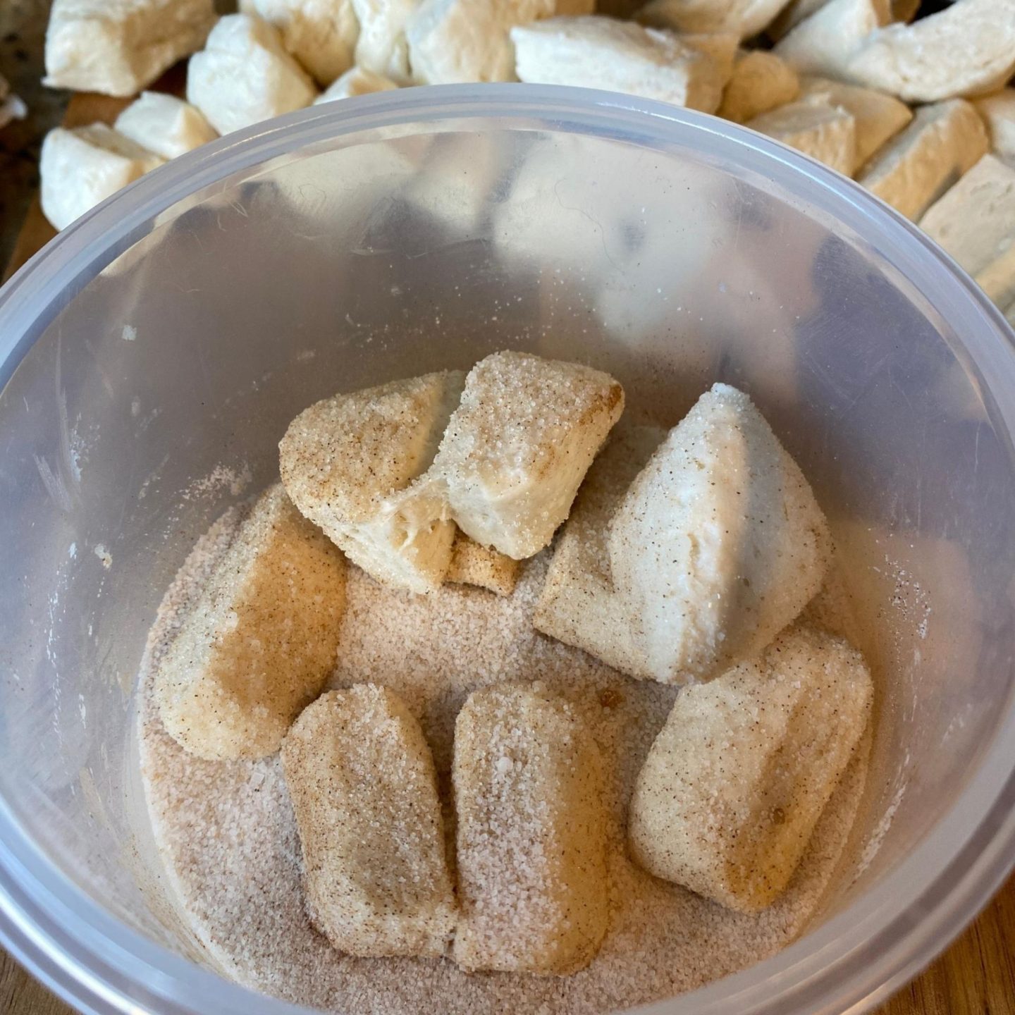 monkey bread dough balls in sugar mixture