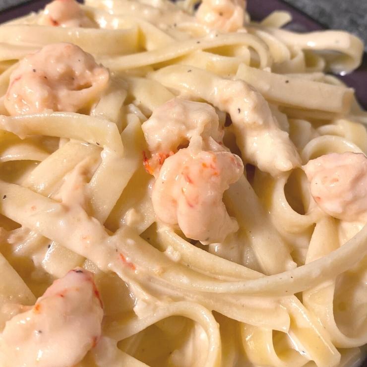 closeup crawfish and shrimp creamy pasta