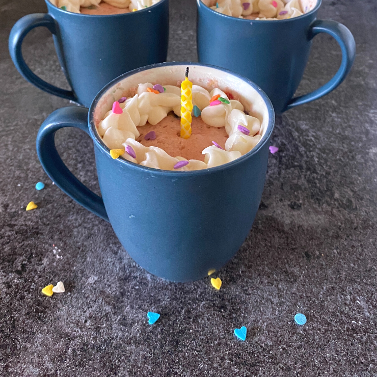 close up of birthday mag cake in coffee cups