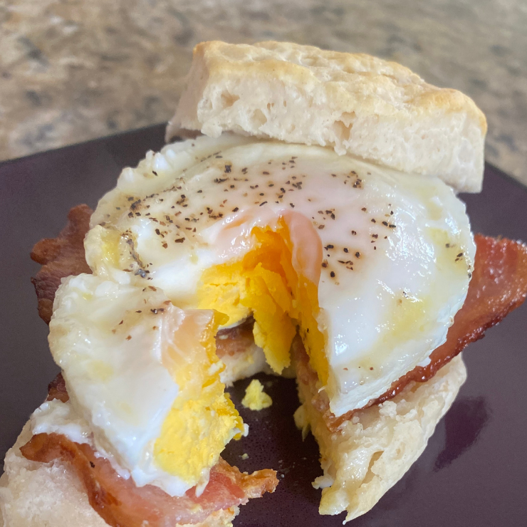 inside of egg and bacon biscuit sandwich