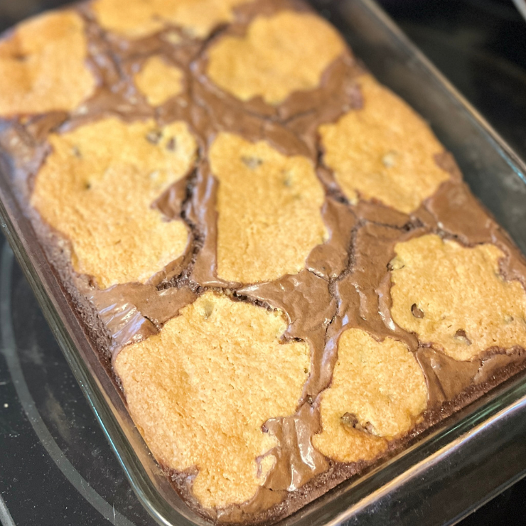 baked sheet of chocolate chip cookie brownie bars