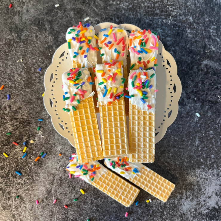 top view chocolate dipped wafer treats with rainbow sprinkles