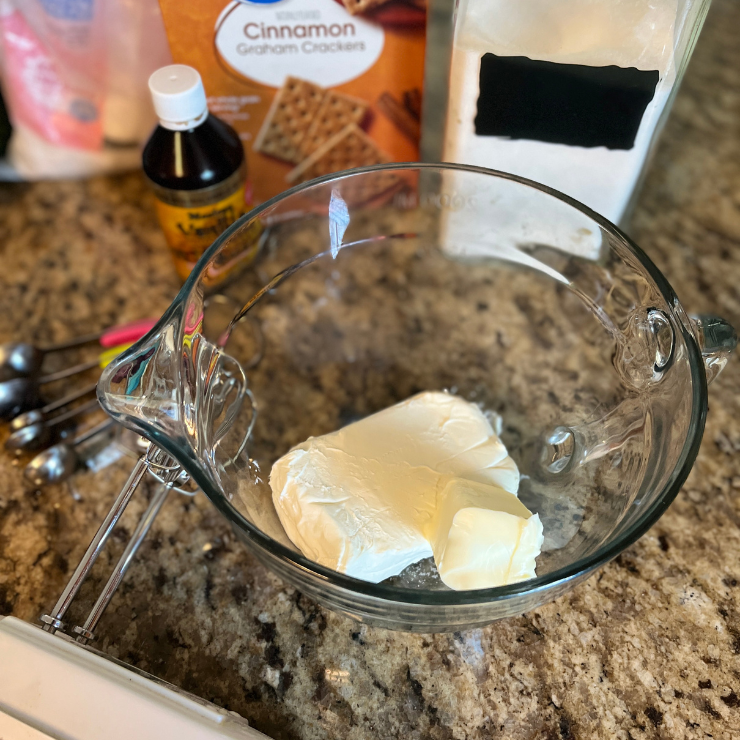 cream cheese and butter in mixing bowl