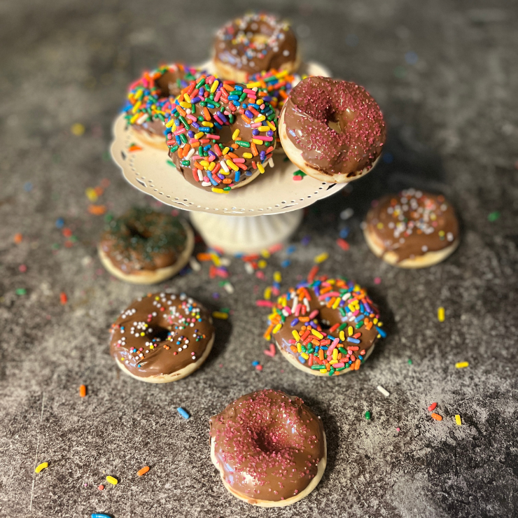 chocolate sprinkled mini donuts in different colors