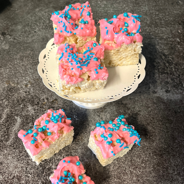 pink cocolate dipped rice krispies treats with turquoise sprinkles